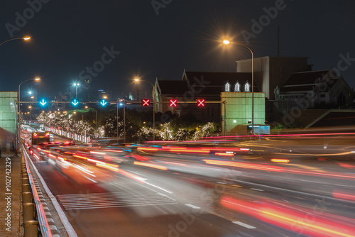 Traffic lights at night at Phra Pin-klao Bridge is a bridge over the Chao Phraya River in Bangkok, Thailand