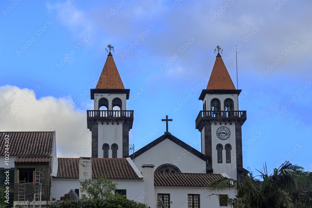 Church of Nossa Senhora da Alegria in Furnas with cloudy blue sk