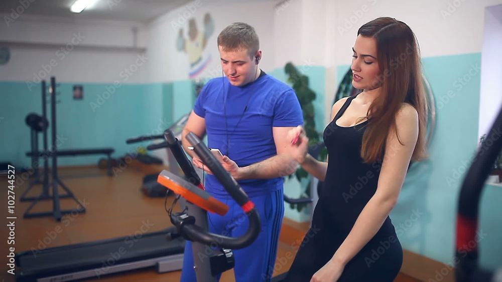 girl athlete drinking water get tired in sport gym trainers girl athlete drinking water get tired in sport gym trainers