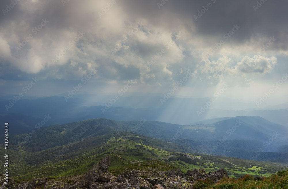 Panorama. Carpathian Mountains. View from Mount Pop Ivan. The rays of the setting sun