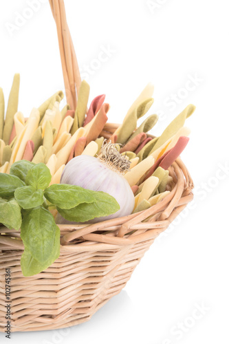 Traditional italian pasta in basket on white