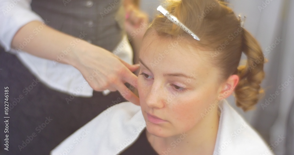 Stylist Hairdresser is Making The Hairstyle Curls and Fixing them on Woman Back of the Head Model's Forelock Fixed by Barrette Barbershop Beauty Salon Stylist Hairdresser is Making The Hairstyle Curls and Fixing them on Woman Back of the Head Model's Forelock Fixed by Barrette Barbershop Beauty Salon