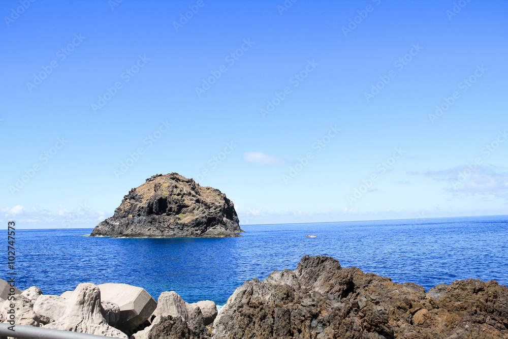 Majestic volcanic rocks on the shore of the Atlantic Ocean, Tenerife, Spain.  No people