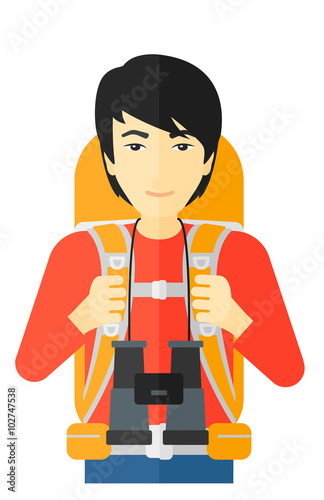 Cheerful backpacker with binoculars.