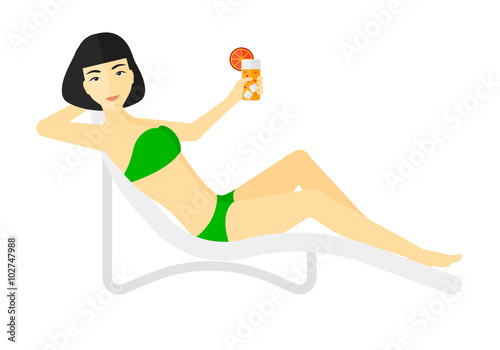 Woman sitting in chaise longue.