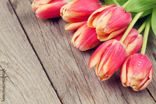 Fototapeta Naklejka Na Ścianę i Meble -  Colorful tulips on wooden table