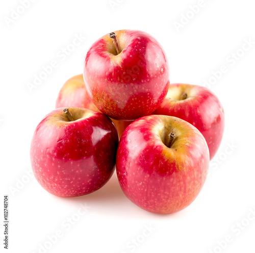 Group of stacked glossy apples studio isolated