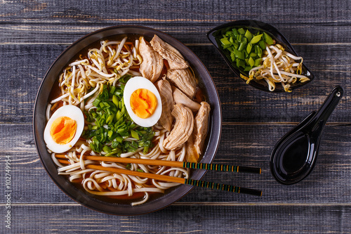 Fotografie Japanese ramen soup with chicken, egg, chives and sprout.