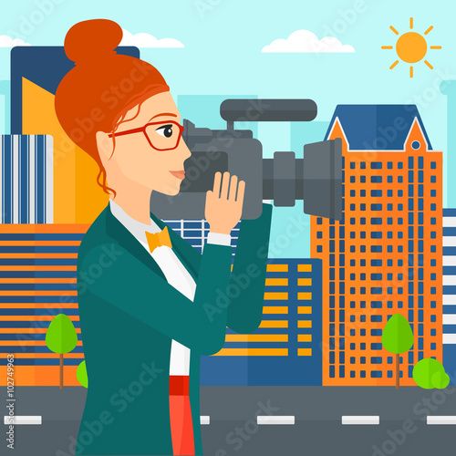 Camerawoman with video camera.