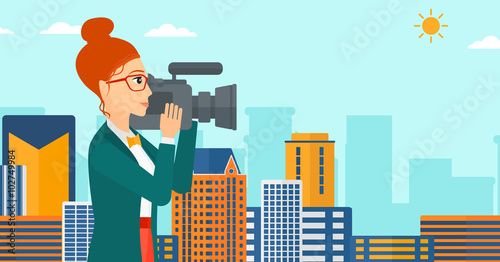 Camerawoman with video camera.