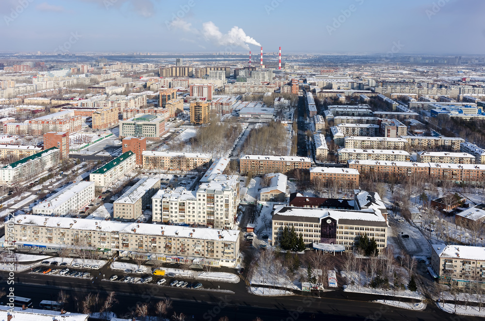 Tyumen, Russia - February 14, 2016: Aerial view onto residential area, office buildings and power station on background