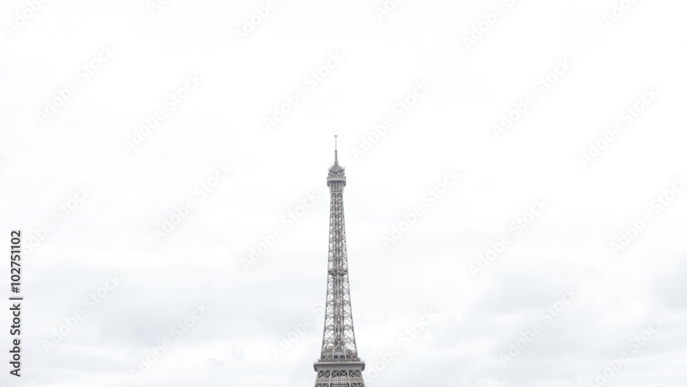 Slow tilt on Eiffel tower lattice construction in front of cloudy sky France Paris 4K 2160p 30fps UltraHDfootage - French monument by the day with clouds on sky Slow tilt on Eiffel tower lattice construction in front of cloudy sky France Paris 4K 2160p 30fps UltraHDfootage - French monument by the day with clouds on sky