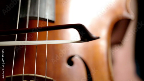 Cellist bowing; detail of bowing technique on strings photo