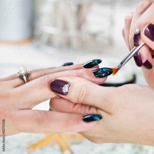 Fingernail design in beauty salon