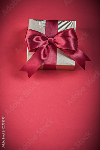 Giftbox on red background holidays concept