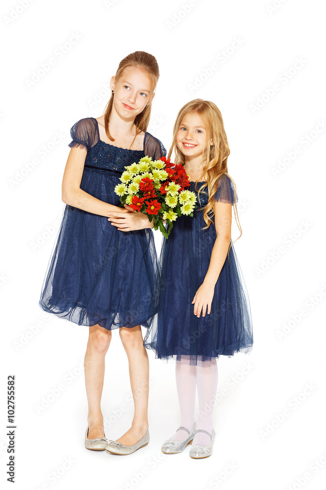 Two beautiful girls with a bouquet of flowers Two beautiful girls with a bouquet of flowers