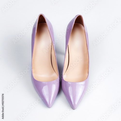 Purple female shoes over white