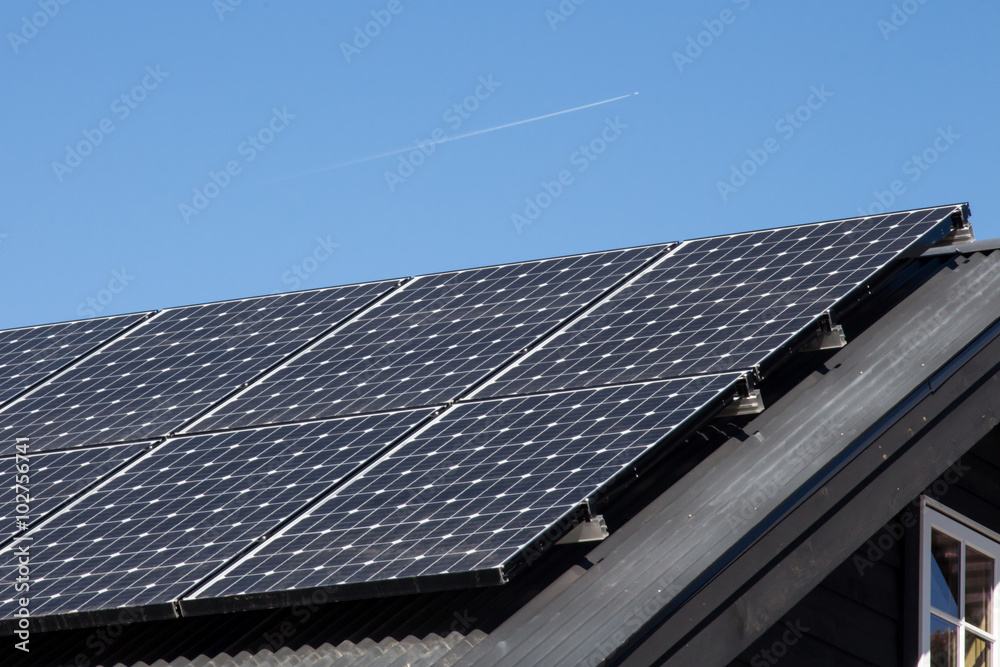 Home solar panels with metal roof and window