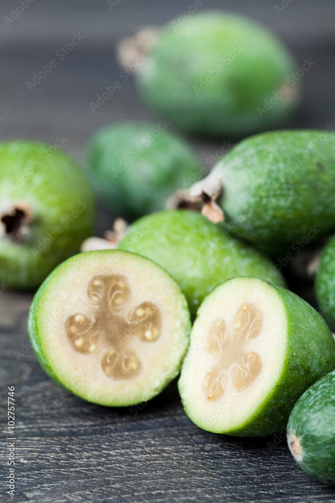 Feijoa on a dark wood background. selective focus