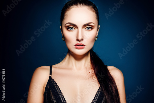 beautiful girl model with blue eyes on a blue background