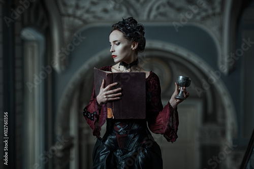 Mystic woman with a book.