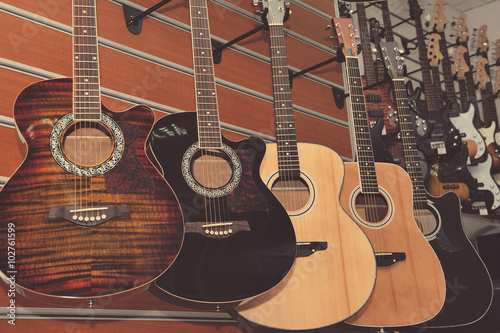 Guitars in the store background