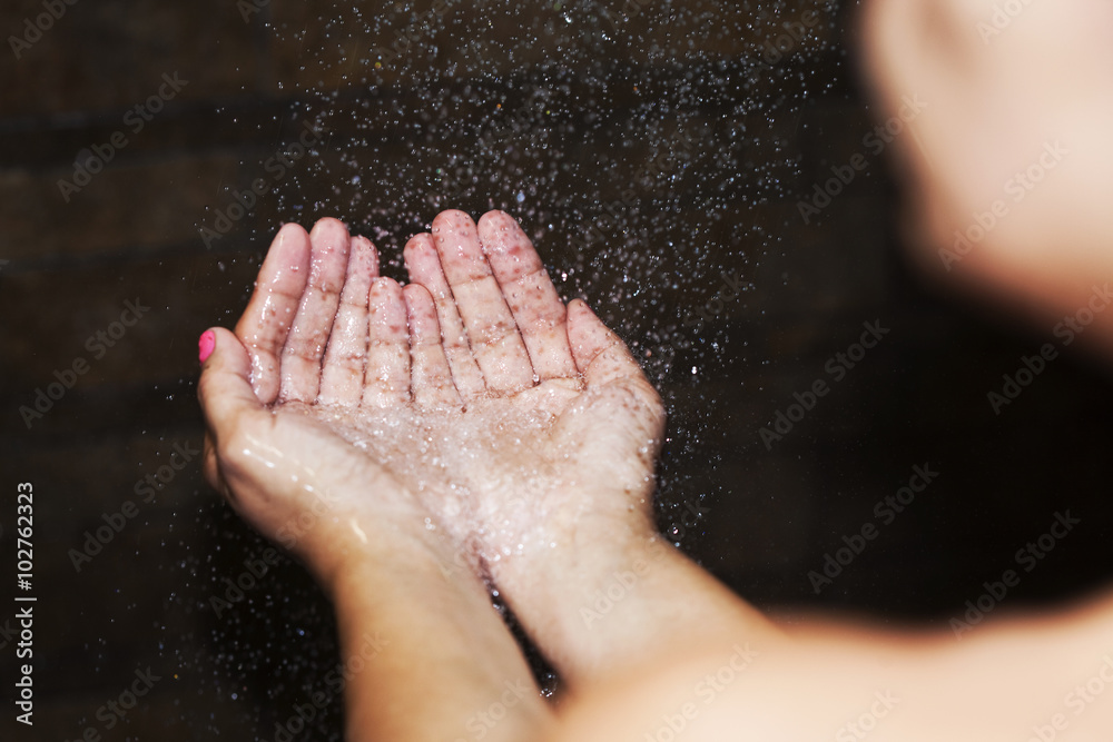 Hands handle shower water Hands handle shower water