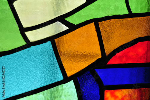Valokuvatapetti Image of a multicolored stained glass window with irregular bloc