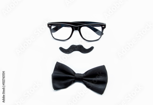 Male dress with black tie, moustache and black glasses