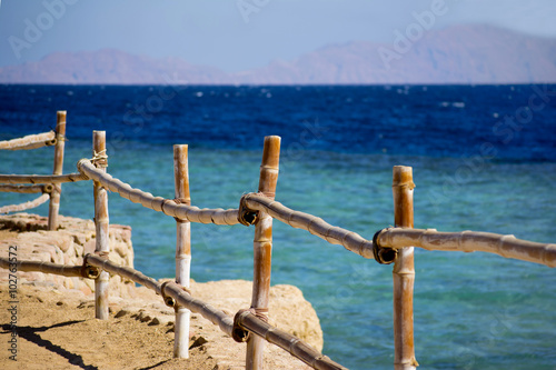 decorative fence on the beach by the sea