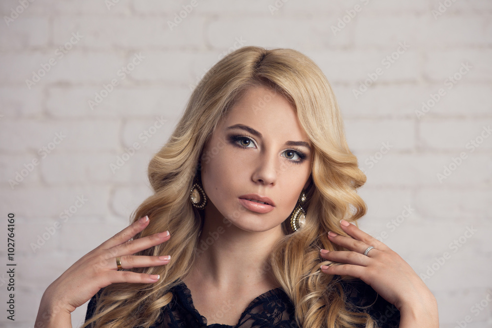 Beautiful model blond with long curled hair