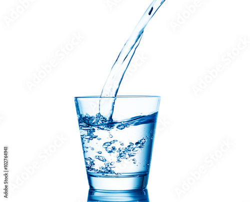 pouring water on a glass isolated onwhite background