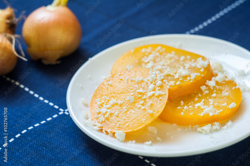 Marinated zucchini. Yellow and juicy zucchini. White cheese