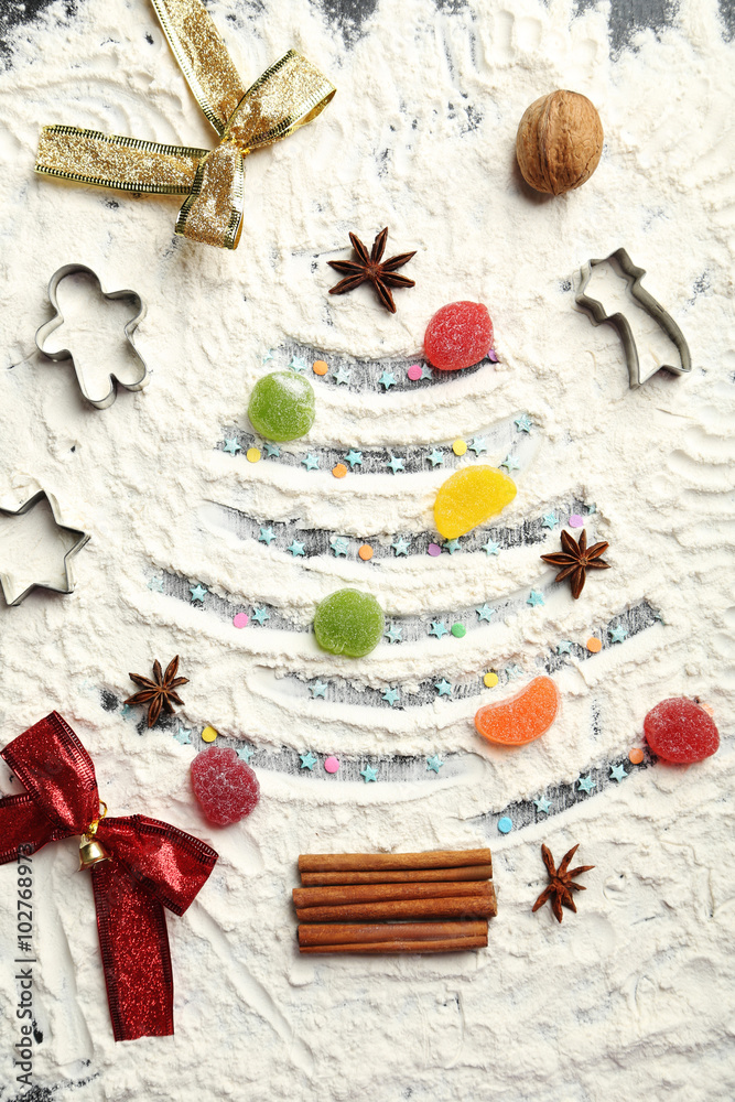 Christmas fir-tree from flour on a wooden table Christmas fir-tree from flour on a wooden table