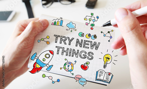 Φωτογραφία Try new things concept on white notebook