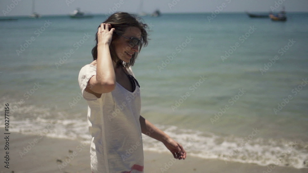 Beautiful woman walking along beach, slow motion shot at 240fps
Beautiful woman walking along beach, slow motion shot at 240fps
