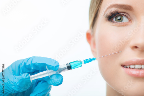 Professional cosmetologist making beauty injections 