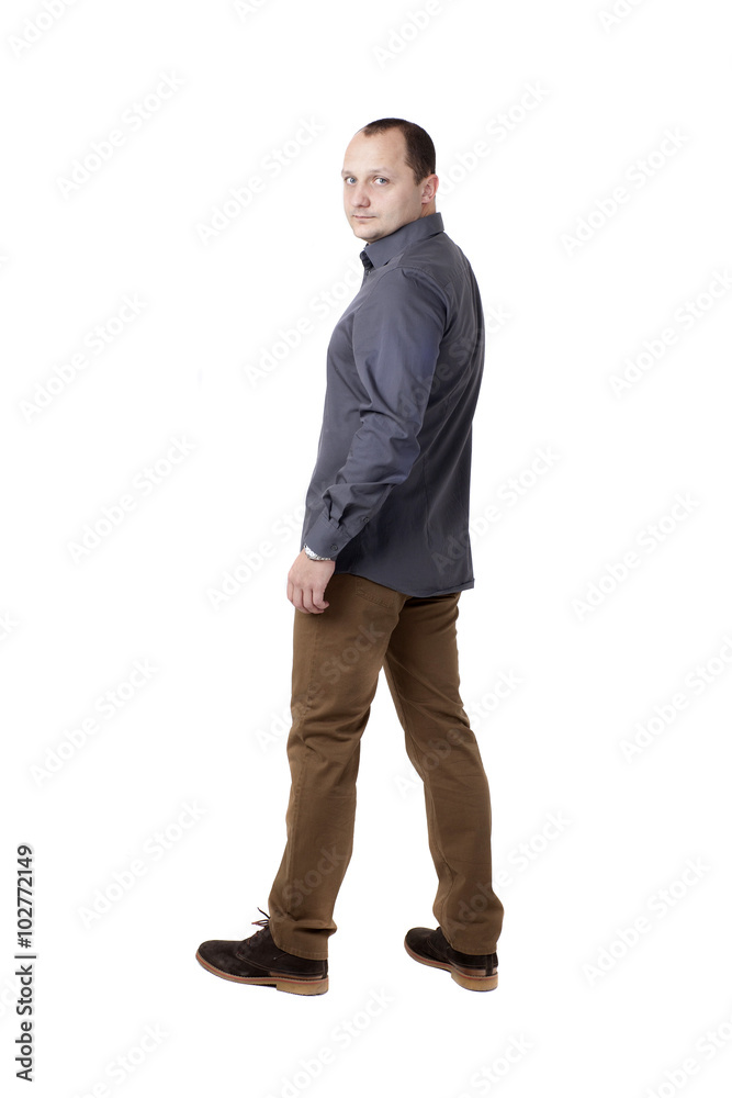 Full length picture of a man standing half-turned on studio. Isolated on white background. Full length picture of a man standing half-turned on studio. Isolated on white background.