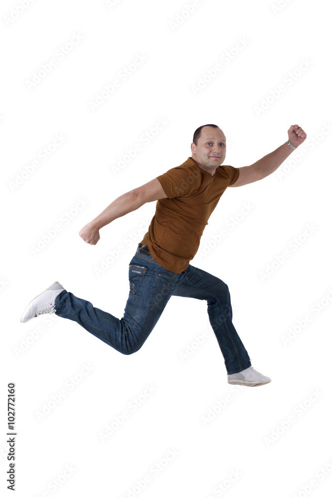 Man jumping and smiling. Studio photography, isolated on white background Man jumping and smiling. Studio photography, isolated on white background