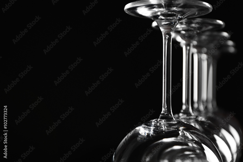 Empty wine glasses on black background, closeup