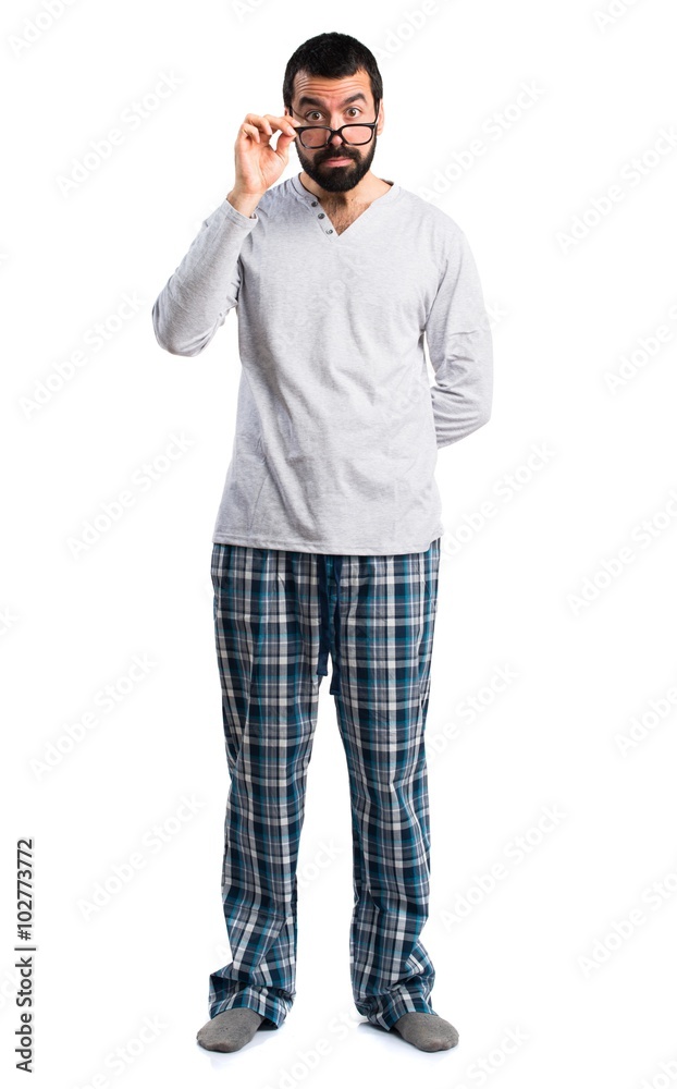 Man in pajamas showing something Man in pajamas showing something