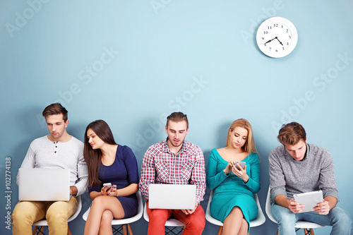 Young people sitting on a c...