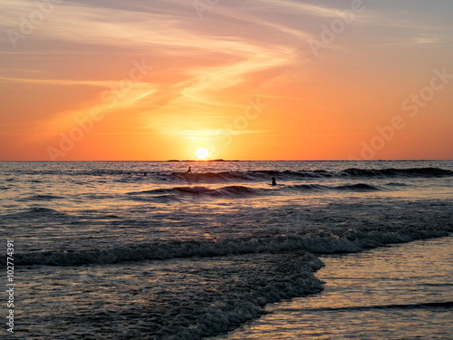 Surfing at Sunset © iferol