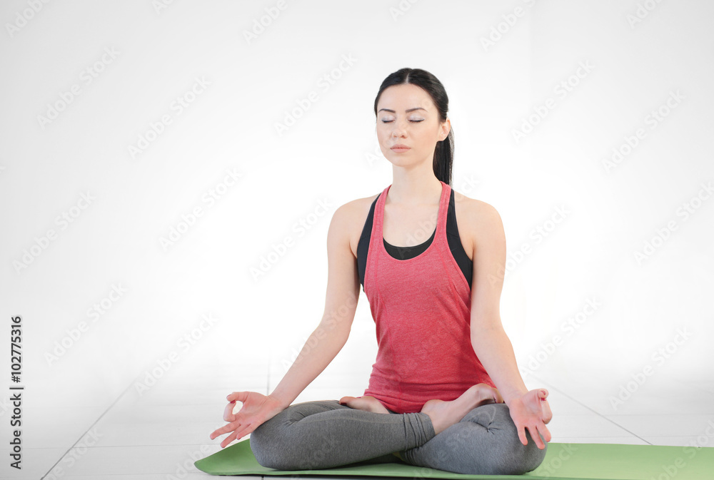 Young attractive woman does yoga in the class Young attractive woman does yoga in the class