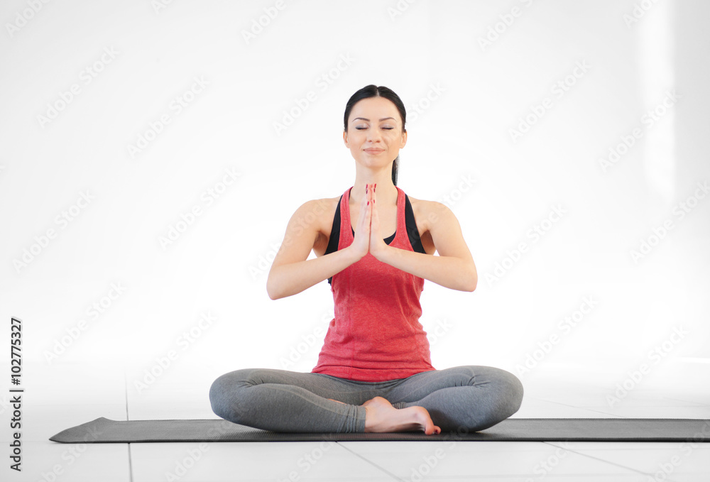 Young attractive woman does yoga in the class Young attractive woman does yoga in the class