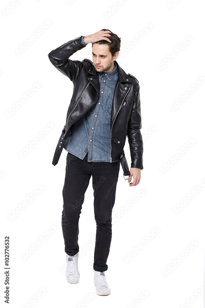 Handsome young man posing in the Studio. portrait in full growth isolated on a white background