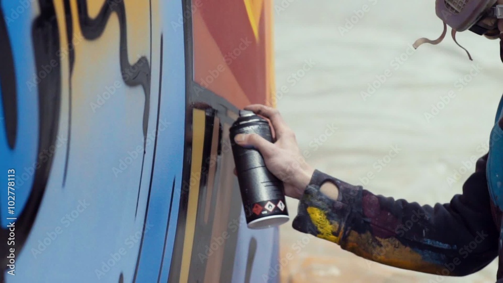 Slow motion graffiti painting on the wall, interior