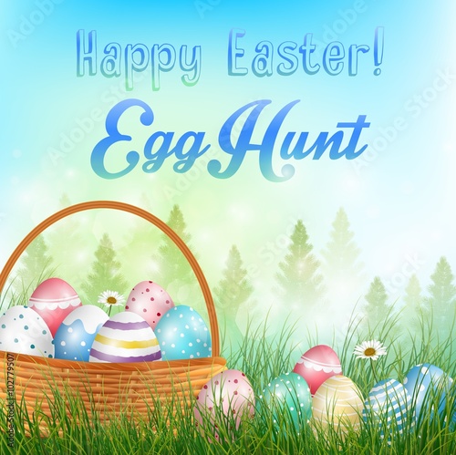 Easter eggs in the basket  Background with field of trees and colored eggs in the grass