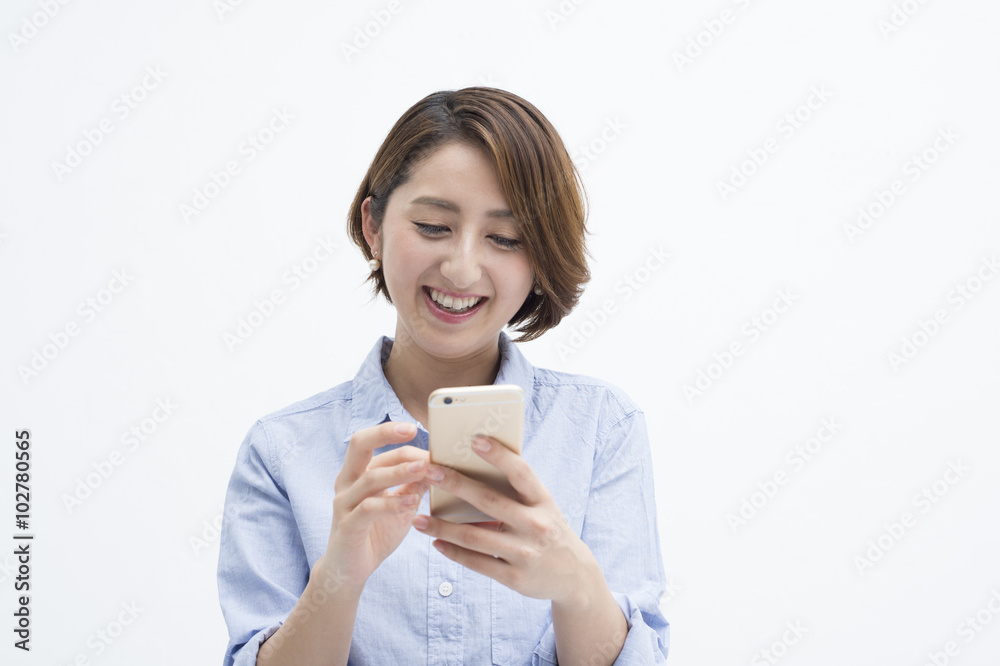 Women are sending e-mail on a smartphone merrily Women are sending e-mail on a smartphone merrily