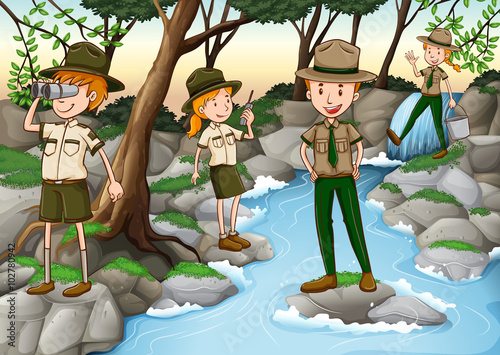 Park rangers standing at the waterfall